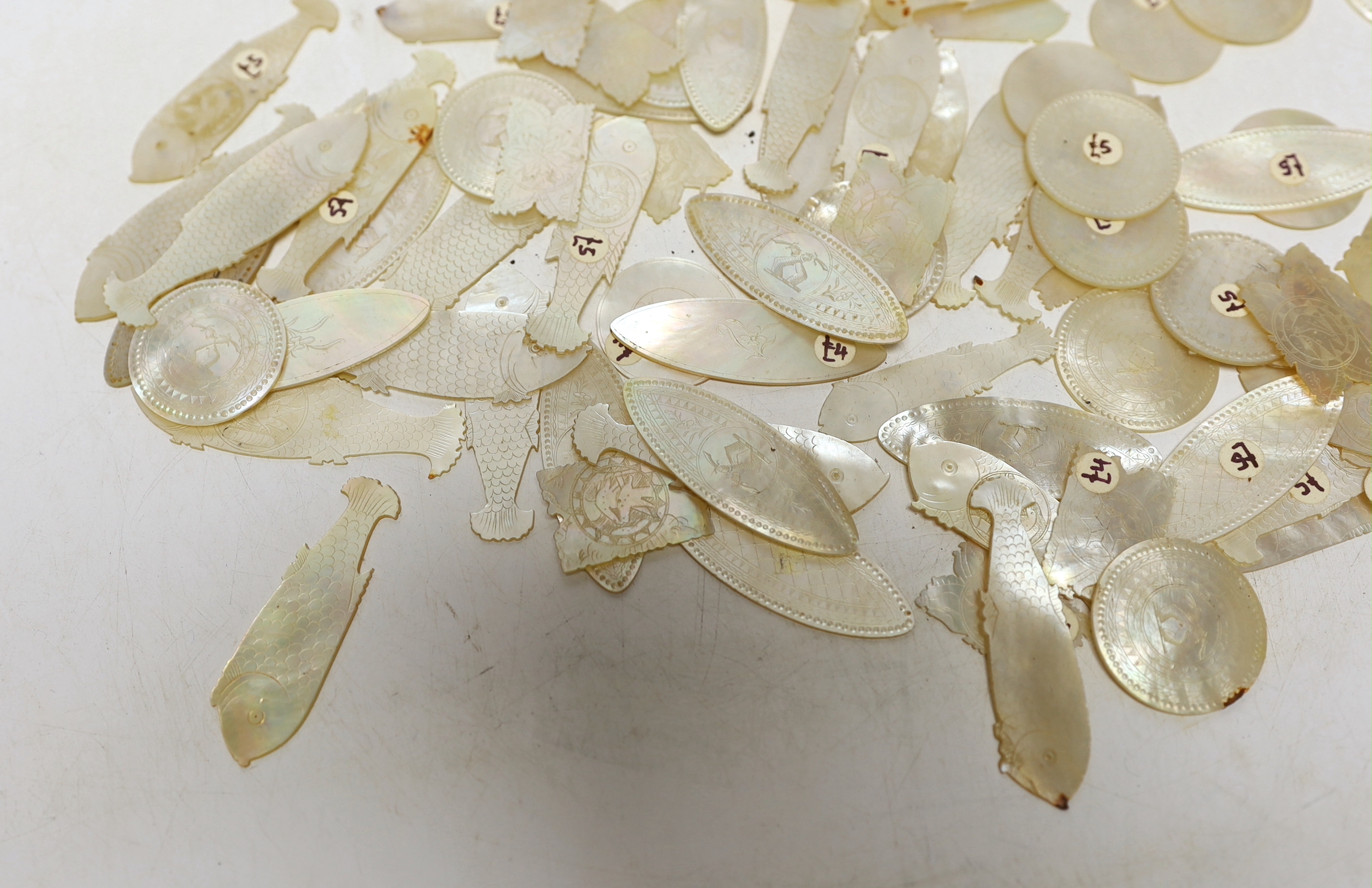 A collection of Chinese mother of pearl gaming counters